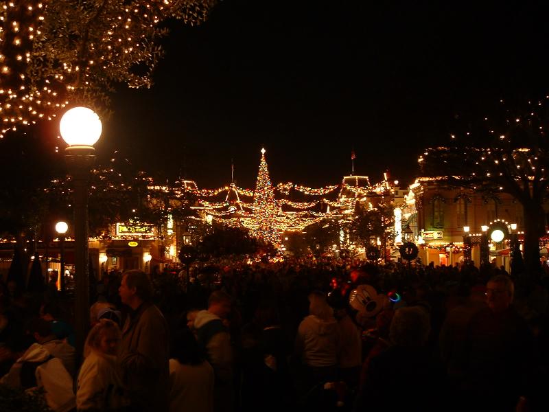People waiting for the Disneyland Parade, with lights and Christmas tree in Main Street, Disneyland